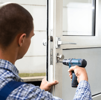 Technician installing door